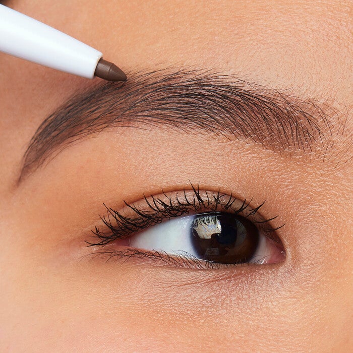 Model Applying Eyebrow Pencil