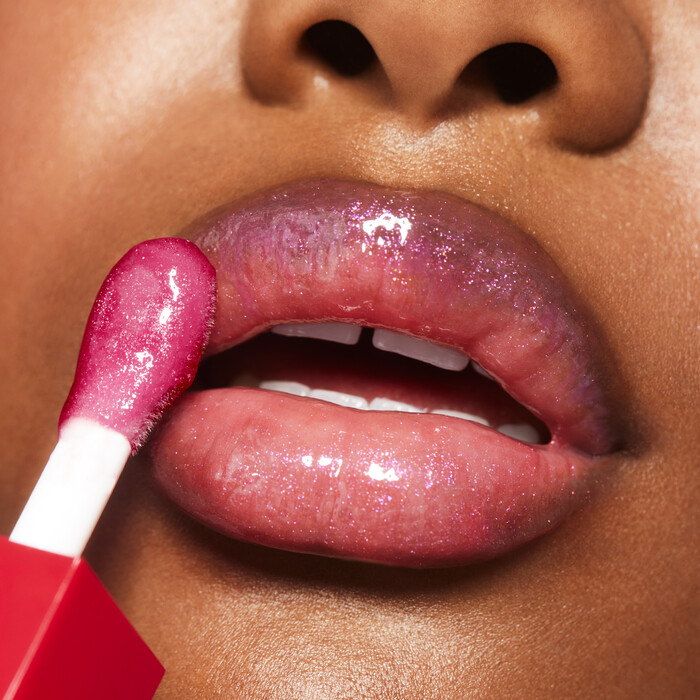 Applying Jelly Pop Lip Oil to Lips
