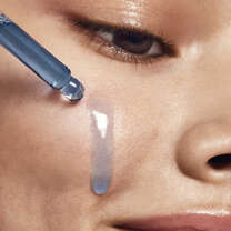 Model Applying Retinoid Face Oil