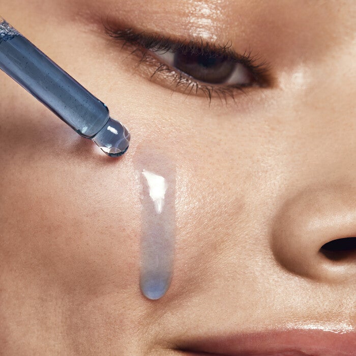 Model Applying Retinoid Face Oil