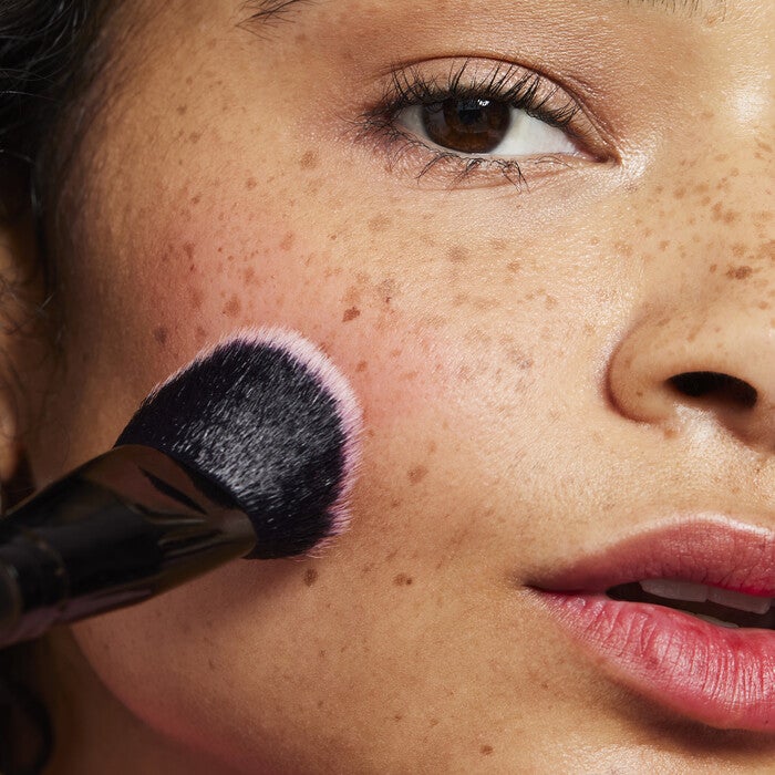 Model Applying Liquid Blush with Stain and Tint Blending Brush