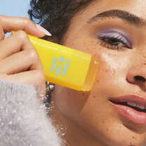 Applying Suntouchable Invsible Sunscreen Stick 