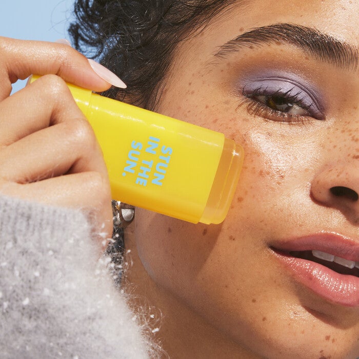 Applying Suntouchable Invsible Sunscreen Stick 