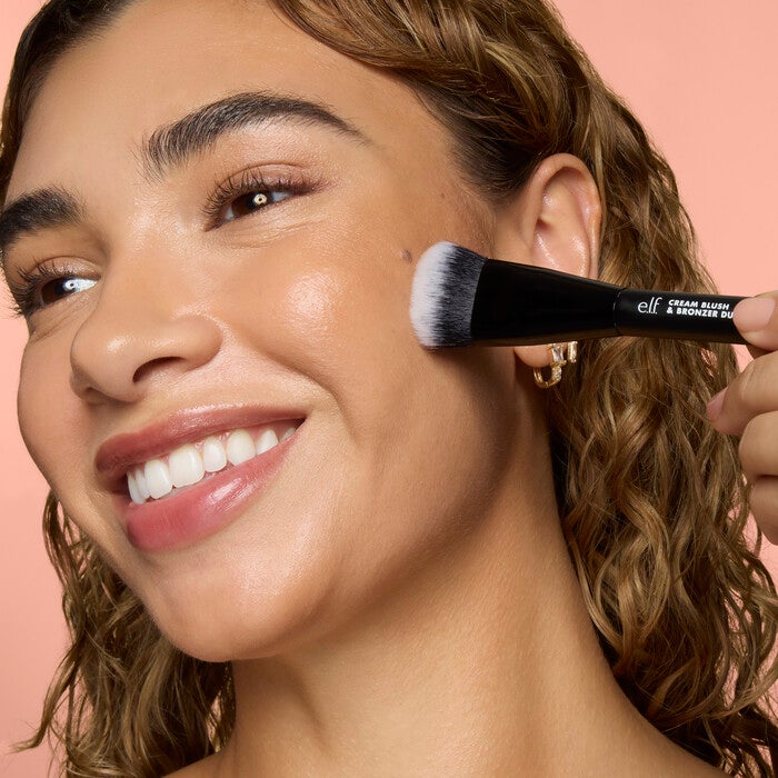 Model Applying Makeup Using the Cream Blush and Bronzer Duo Makeup Brush