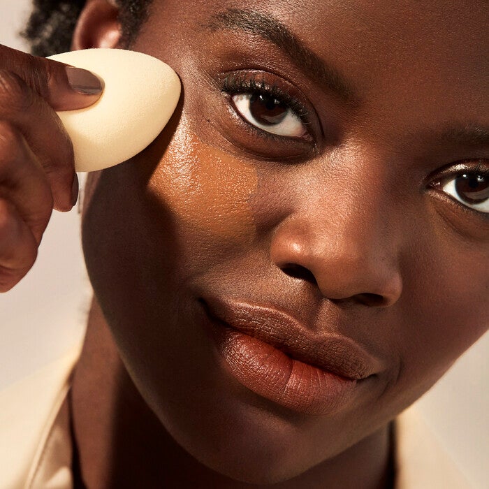 Applying Camo CC Cream with Concealer Sponge