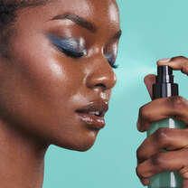 Applying Makeup Setting Spray for a Dewy Look