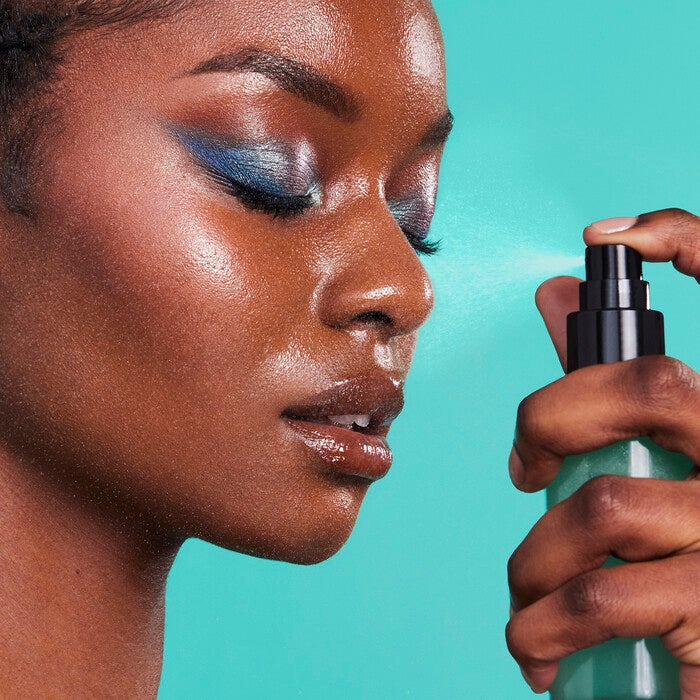 Applying Makeup Setting Spray for a Dewy Look