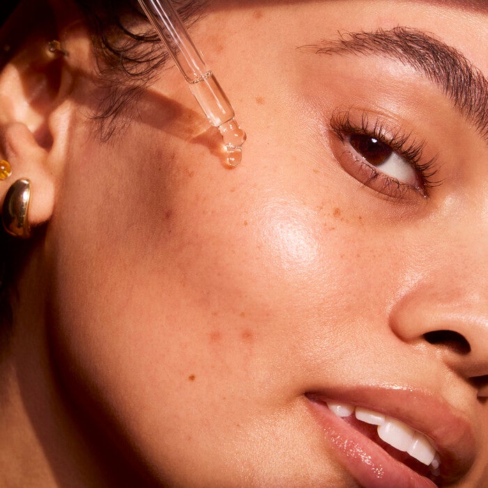 Applying Brightening Face Serum 