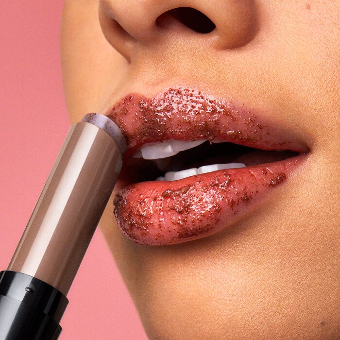 Model Applying e.l.f.'s Sugar Lip Scrub
