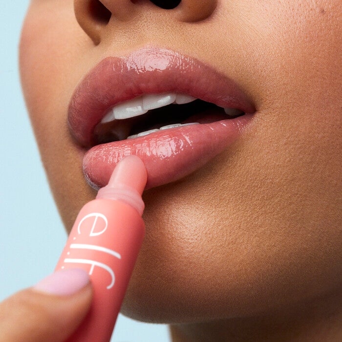 Model Applying Strawberry Lip Balm