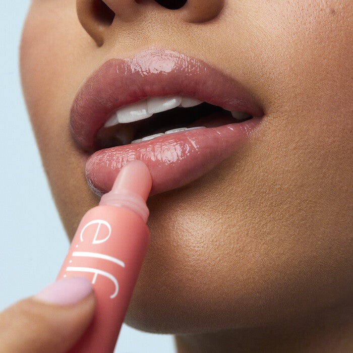 Model Applying Strawberry Lip Balm