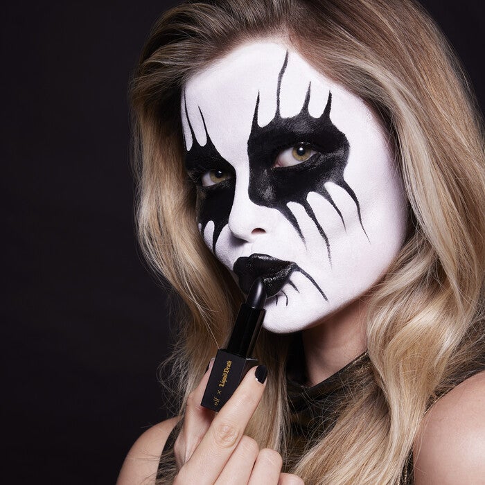 Corpse Paint Model Applying Black Lipstick