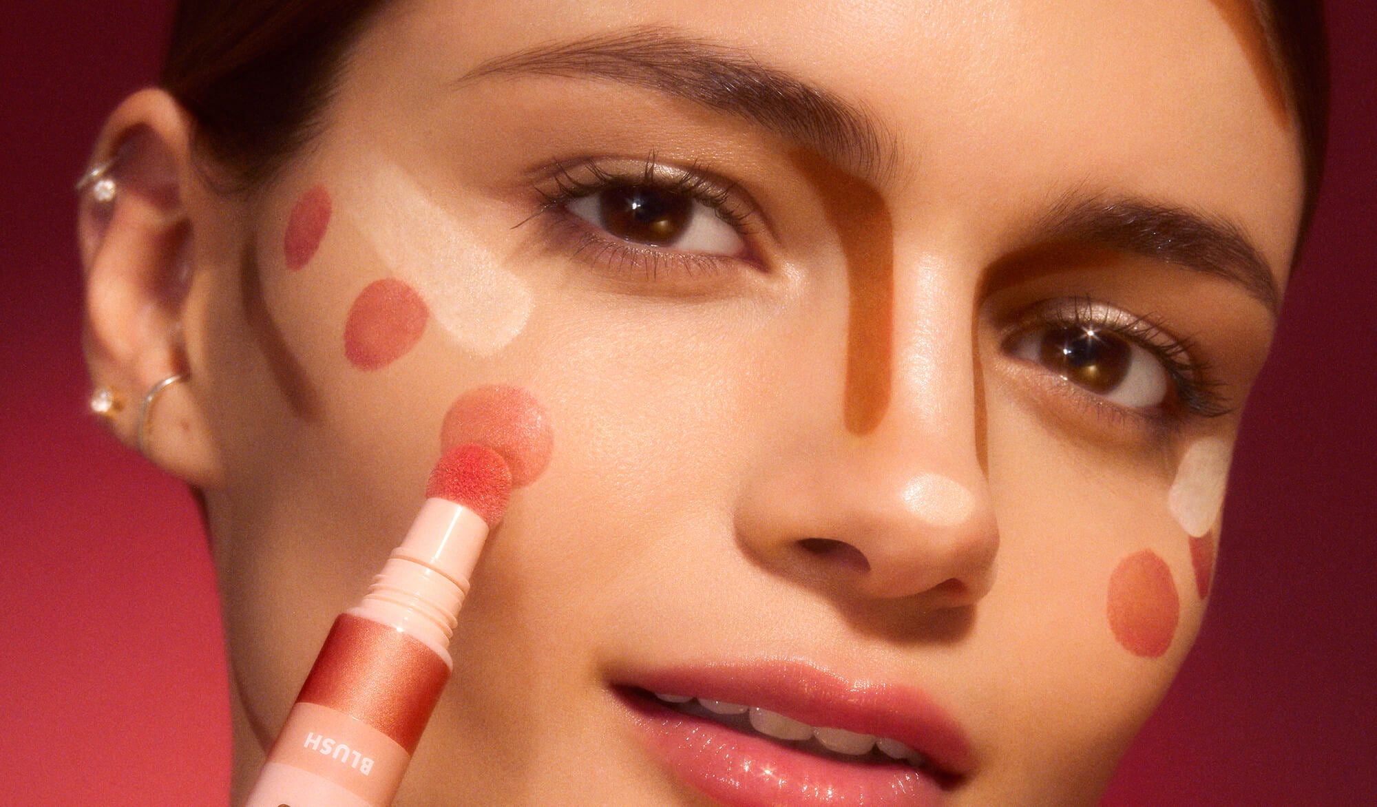 Woman applying all beauty wand products